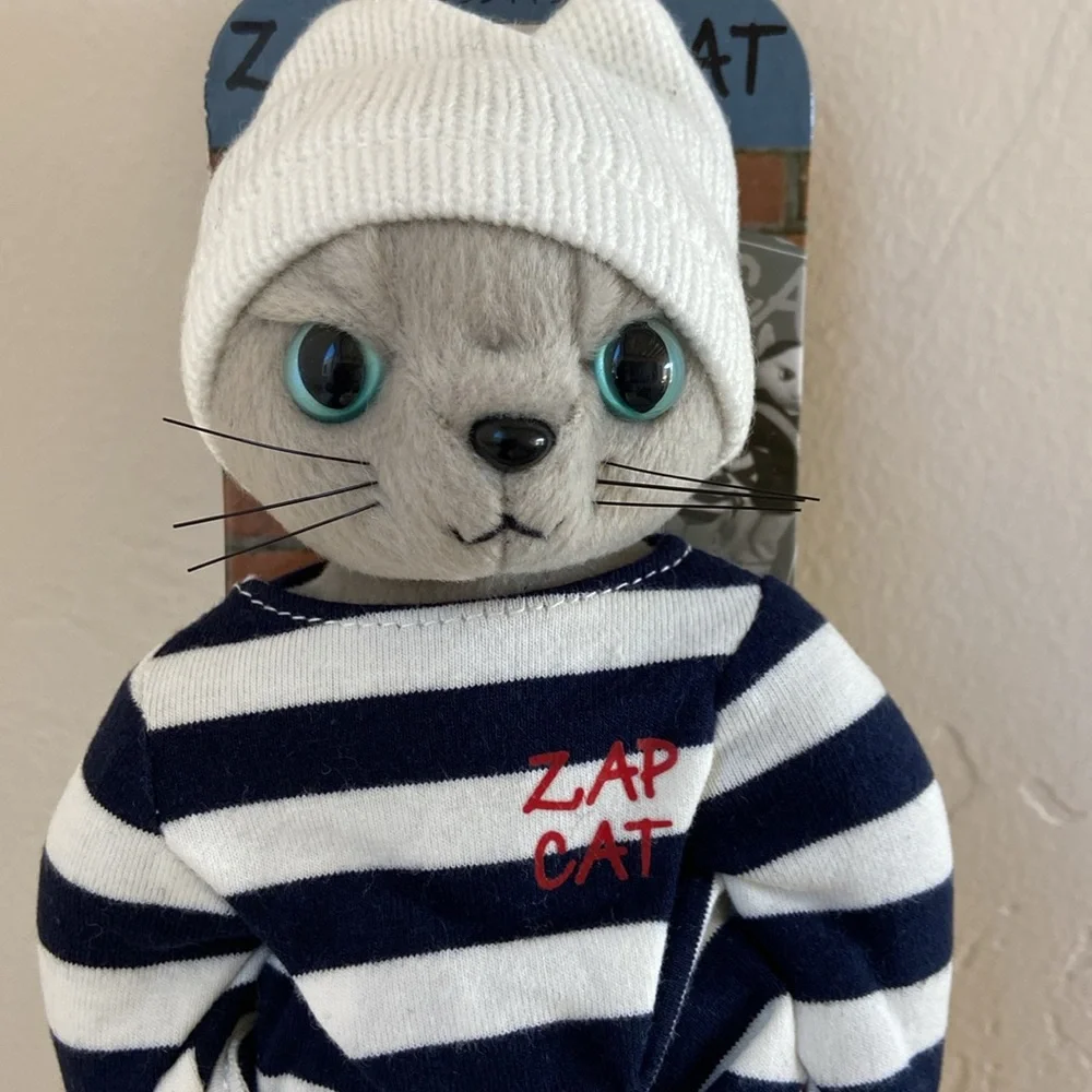 Highly collectible Japanese Zap Cat plush figure. Grey kitty. New on stand.